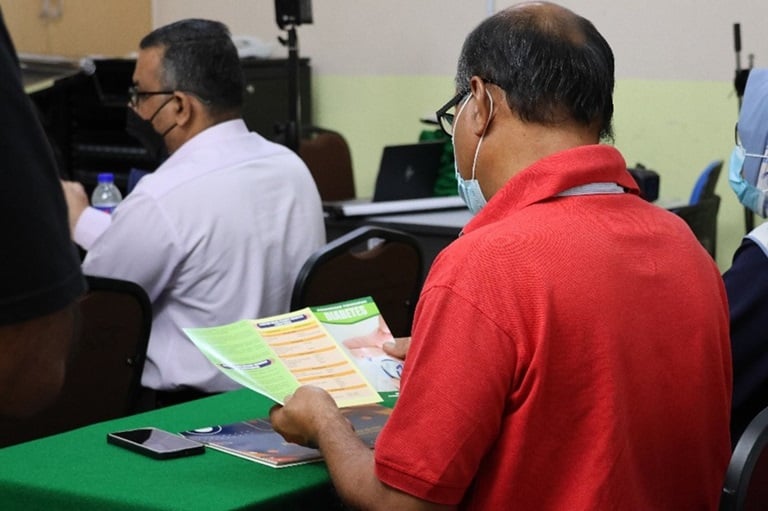 Patient reading a Lifestyle Medicine pamphlet.